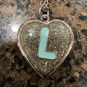 Silver tone Heart Locket Necklace with Blue enameled “L” on sparkle base